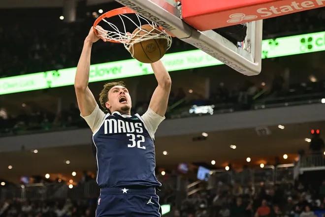 Mar 31, 2026; Milwaukee, Wisconsin, USA; Dallas Mavericks forward Cooper Flagg (32) dunks the ball in the fourth quarter against the Milwaukee Bucks at Fiserv Forum.