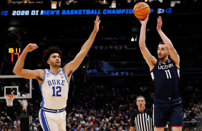 Mar 29, 2026; Washington, DC, USA; UConn Huskies forward Alex Karaban (11) shoots over Duke Blue Devils forward Cameron Boozer (12) in the first half during an Elite Eight game of the East Regional of the men's 2026 NCAA Tournament at Capital One Arena. Mandatory Credit: Geoff Burke-Imagn Images