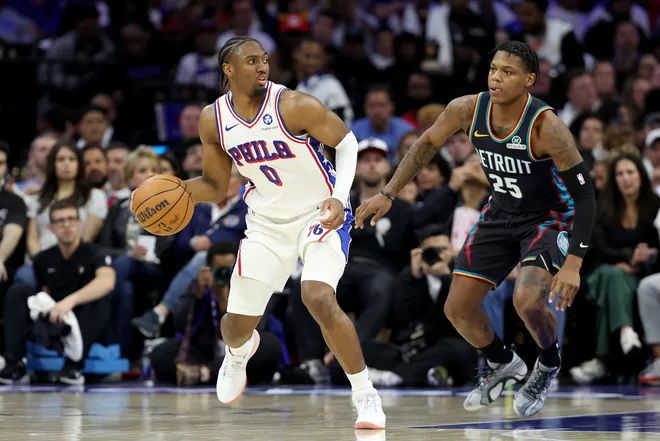 PHILADELPHIA, PENNSYLVANIA - APRIL 04: Tyrese Maxey #0 of the Philadelphia 76ers drives against Marcus Sasser #25 of the Detroit Pistons during the second half at Xfinity Mobile Arena on April 04, 2026 in Philadelphia, Pennsylvania. NOTE TO USER: User expressly acknowledges and agrees that, by downloading and or using this photograph, User is consenting to the terms and conditions of the Getty Images License Agreement. (Photo by Emilee Chinn/Getty Images)