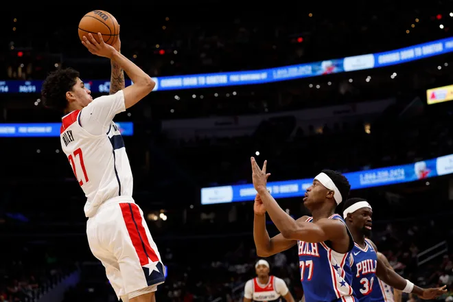 Apr 1, 2026; Washington, District of Columbia, USA; Washington Wizards guard Will Riley (27) shoots the ball over Philadelphia 76ers guard Vj Edgecombe (77) in the second half at Capital One Arena. Mandatory Credit: Geoff Burke-Imagn Images