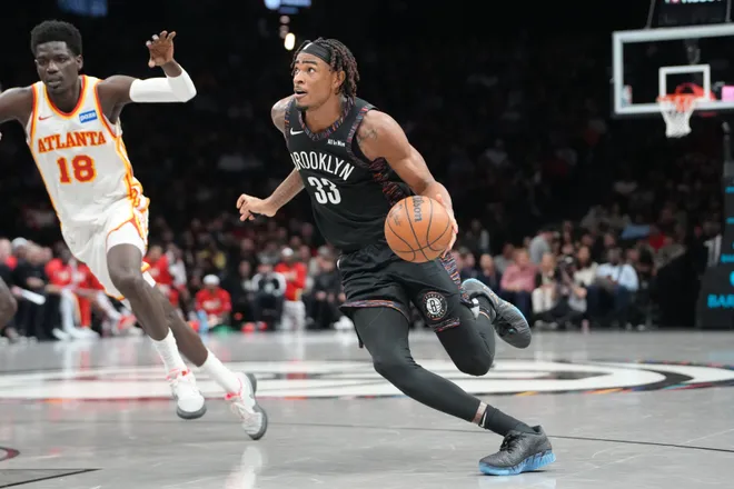 Apr 3, 2026; Brooklyn, New York, USA; Brooklyn Nets center Nic Claxton (33) dribbles the ball towards the basket against the Atlanta Hawks during the first half at Barclays Center. Mandatory Credit: Gregory Fisher-Imagn Images