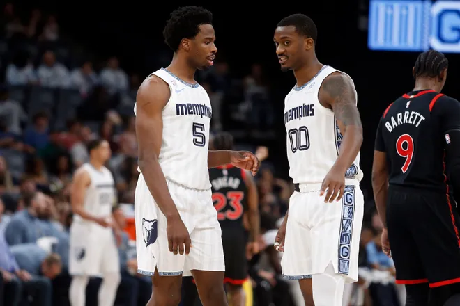 Apr 3, 2026; Memphis, Tennessee, USA; Memphis Grizzlies forward Toby Okani (5) and forward Dariq Whitehead (00) talk during the first quarter against the Toronto Raptors at FedExForum. Mandatory Credit: Petre Thomas-Imagn Images