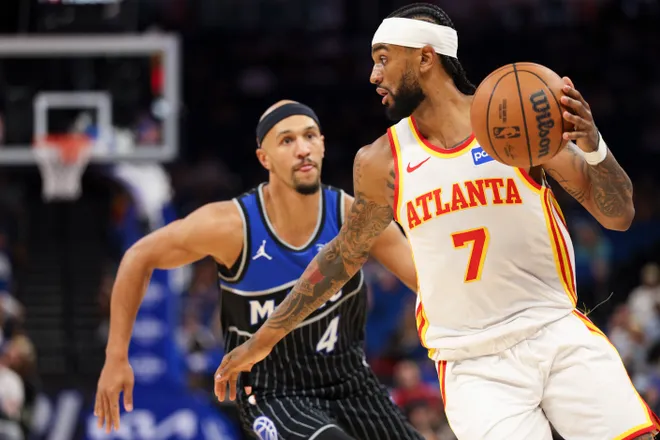Apr 1, 2026; Orlando, Florida, USA; Atlanta Hawks guard Nickeil Alexander-Walker (7) moves the ball past Orlando Magic guard Jalen Suggs (4) in the first quarter at Kia Center. Mandatory Credit: Nathan Ray Seebeck-Imagn Images