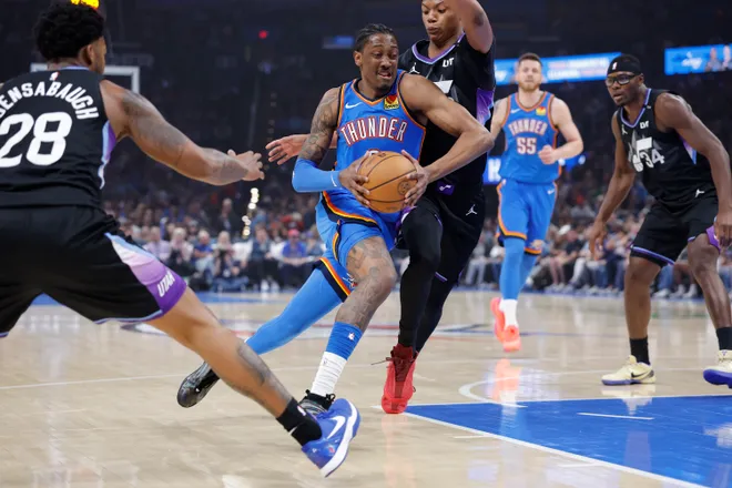 Apr 5, 2026; Oklahoma City, Oklahoma, USA; Oklahoma City Thunder guard Jalen Williams (8) drives between Utah Jazz forward Brice Sensabaugh (28) and guard Ace Bailey (19) during the first quarter at Paycom Center. Mandatory Credit: Alonzo Adams-Imagn Images