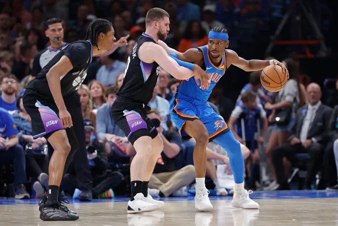 Apr 5, 2026; Oklahoma City, Oklahoma, USA; Oklahoma City Thunder guard Shai Gilgeous-Alexander (2) drives against Utah Jazz guard Svi Mykhailiuk (10) during the second half at Paycom Center. Mandatory Credit: Alonzo Adams-Imagn Images
