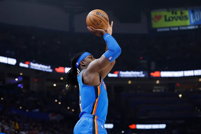 Apr 5, 2026; Oklahoma City, Oklahoma, USA; Oklahoma City Thunder guard Luguentz Dort (5) shoots a three point basket against the Utah Jazz during the second quarter at Paycom Center. Mandatory Credit: Alonzo Adams-Imagn Images