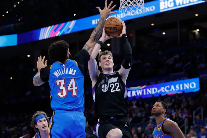 Apr 5, 2026; Oklahoma City, Oklahoma, USA; Utah Jazz forward Kyle Filipowski (22) goes up for a shot as Oklahoma City Thunder guard Kenrich Williams (34) defends during the second half at Paycom Center. Mandatory Credit: Alonzo Adams-Imagn Images