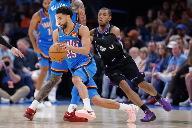 Apr 5, 2026; Oklahoma City, Oklahoma, USA; Oklahoma City Thunder guard Ajay Mitchell (25) moves past Utah Jazz guard Kennedy Chandler (0) during the second half at Paycom Center. Mandatory Credit: Alonzo Adams-Imagn Images