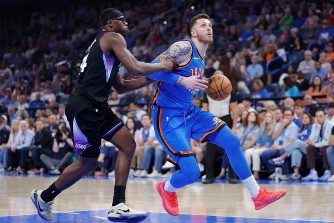 Apr 5, 2026; Oklahoma City, Oklahoma, USA; Oklahoma City Thunder center Isaiah Hartenstein (55) drives past Utah Jazz center Oscar Tshiebwe (34) during the second quarter at Paycom Center. Mandatory Credit: Alonzo Adams-Imagn Images