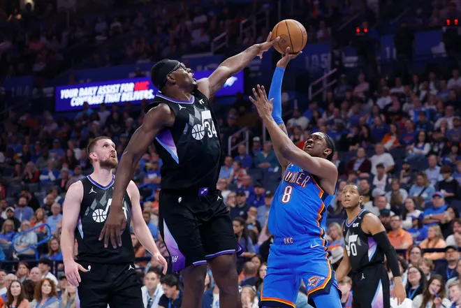 Apr 5, 2026; Oklahoma City, Oklahoma, USA; Utah Jazz center Oscar Tshiebwe (34) blocks a shot by Oklahoma City Thunder guard Jalen Williams (8) during the second quarter at Paycom Center. Mandatory Credit: Alonzo Adams-Imagn Images