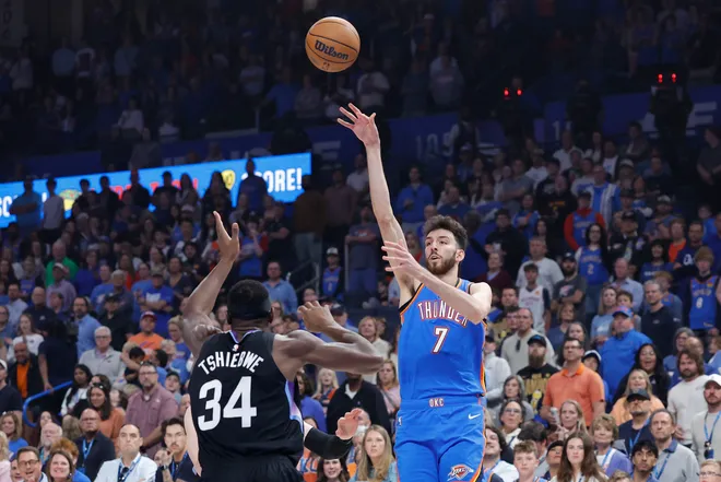 Apr 5, 2026; Oklahoma City, Oklahoma, USA; Oklahoma City Thunder center Chet Holmgren (7) shoots over Utah Jazz center Oscar Tshiebwe (34) during the first quarter at Paycom Center. Mandatory Credit: Alonzo Adams-Imagn Images