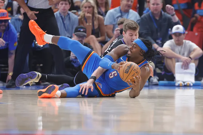 Apr 5, 2026; Oklahoma City, Oklahoma, USA; Utah Jazz forward Kyle Filipowski (22) and Oklahoma City Thunder guard Luguentz Dort (5) fight for a loose ball during the first quarter at Paycom Center. Mandatory Credit: Alonzo Adams-Imagn Images