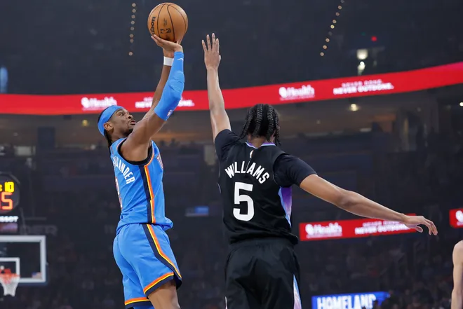 Apr 5, 2026; Oklahoma City, Oklahoma, USA; Oklahoma City Thunder guard Shai Gilgeous-Alexander (2) shoots as Utah Jazz forward Cody Williams (5) defends during the first quarter at Paycom Center. Mandatory Credit: Alonzo Adams-Imagn Images