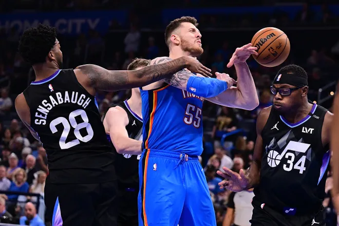 OKLAHOMA CITY, OKLAHOMA - APRIL 5: Isaiah Hartenstein #55 of the Oklahoma City Thunder is fouled while shooting by Brice Sensabaugh #28 of the Utah Jazz during the second half at Paycom Center on April 5, 2026 in Oklahoma City, Oklahoma. NOTE TO USER: User expressly acknowledges and agrees that, by downloading and or using this photograph, User is consenting to the terms and conditions of the Getty Images License Agreement. (Photo by Joshua Gateley/Getty Images)