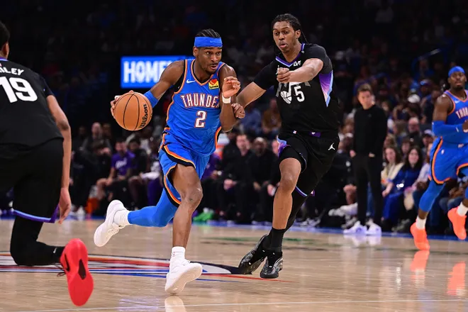 OKLAHOMA CITY, OKLAHOMA - APRIL 5: Shai Gilgeous-Alexander #2 of the Oklahoma City Thunder attempts to drive the ball past Cody Williams #5 of the Utah Jazz during the second half at Paycom Center on April 5, 2026 in Oklahoma City, Oklahoma. NOTE TO USER: User expressly acknowledges and agrees that, by downloading and or using this photograph, User is consenting to the terms and conditions of the Getty Images License Agreement. (Photo by Joshua Gateley/Getty Images)