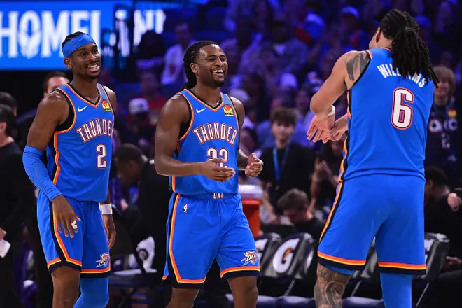 OKLAHOMA CITY, OKLAHOMA - APRIL 5: Cason Wallace #22, Shai Gilgeous-Alexander #2, and Jaylin Williams #6 of the Oklahoma City Thunder celebrate during the first half against the Utah Jazz at Paycom Center on April 5, 2026 in Oklahoma City, Oklahoma. NOTE TO USER: User expressly acknowledges and agrees that, by downloading and or using this photograph, User is consenting to the terms and conditions of the Getty Images License Agreement. (Photo by Joshua Gateley/Getty Images)