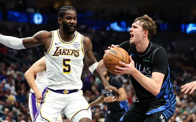 Apr 5, 2026; Dallas, Texas, USA; Dallas Mavericks forward Cooper Flagg (32) looks to shoot as Los Angeles Lakers center Deandre Ayton (5) defends during the first half at American Airlines Center.