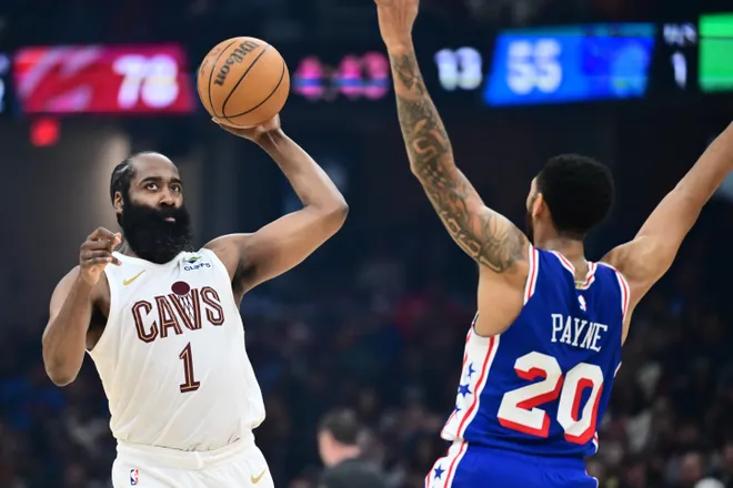 Mar 9, 2026; Cleveland, Ohio, USA; Cleveland Cavaliers guard James Harden (1) looks to pass as Philadelphia 76ers guard Cameron Payne (20) defends during the second half at Rocket Arena. Mandatory Credit: Ken Blaze-Imagn Images