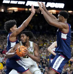 Michigan Wolverines forward Morez Johnson Jr. (21) looks for space under the basket Monday, April 6, 2026, against the UConn Huskies during the NCAA men's basketball tournament national championship game at Lucas Oil Stadium in Indianapolis.