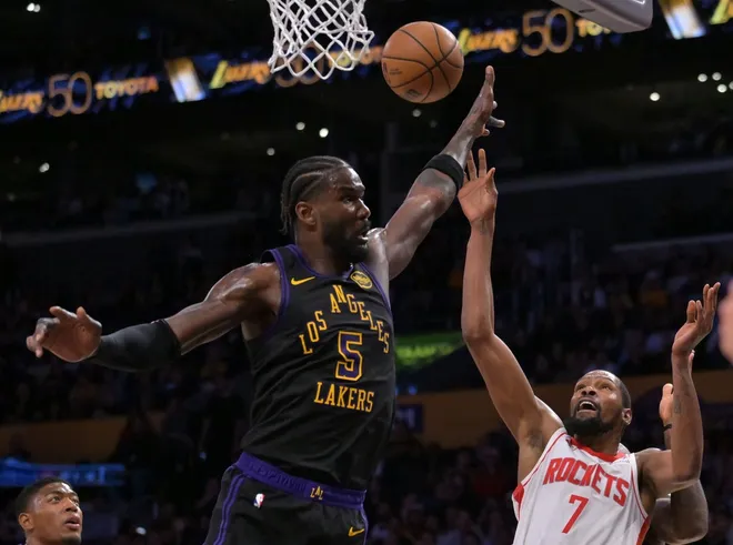 Apr 21, 2026; Los Angeles, California, USA; Houston Rockets forward Kevin Durant (7) is defended by Los Angeles Lakers center Deandre Ayton (5) as he drives to the basket during the second half of game two of the first round of the 2026 NBA Playoffs at Crypto.com Arena.