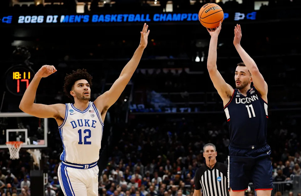 Mar 29, 2026; Washington, DC, USA; UConn Huskies forward Alex Karaban (11) shoots over Duke Blue Devils forward Cameron Boozer (12) in the first half during an Elite Eight game of the East Regional of the men's 2026 NCAA Tournament at Capital One Arena. Mandatory Credit: Geoff Burke-Imagn Images