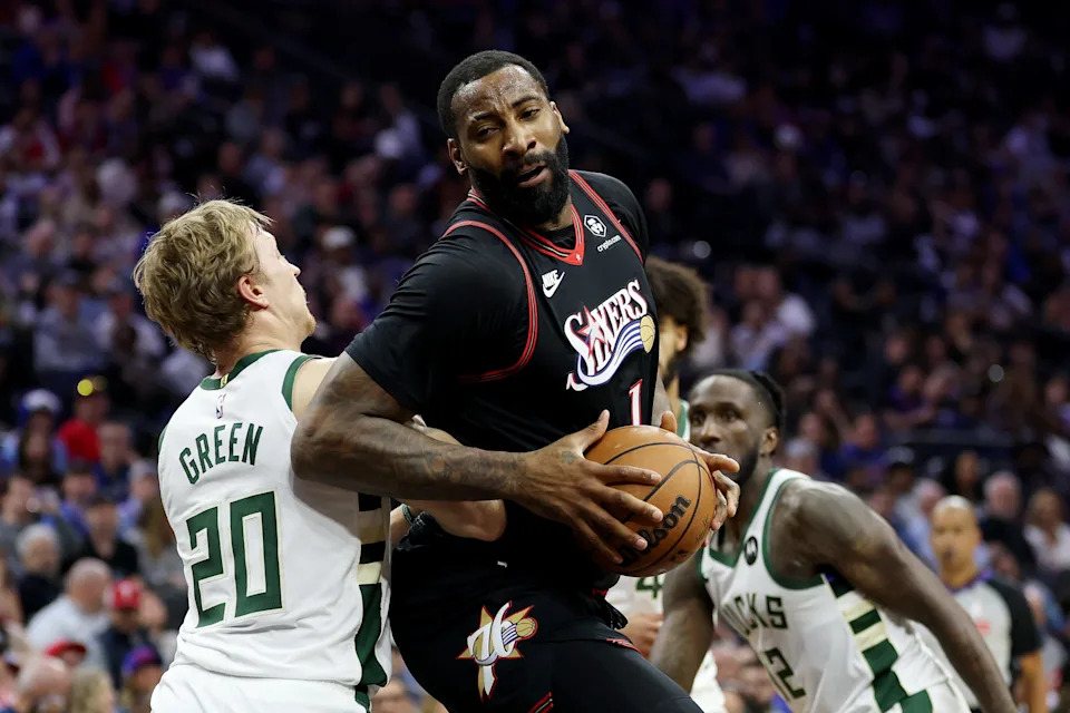 PHILADELPHIA, PENNSYLVANIA - APRIL 12: Andre Drummond #1 of the Philadelphia 76ers drives past AJ Green #20 of the Milwaukee Bucks during the first half at Xfinity Mobile Arena on April 12, 2026 in Philadelphia, Pennsylvania. NOTE TO USER: User expressly acknowledges and agrees that, by downloading and or using this photograph, User is consenting to the terms and conditions of the Getty Images License Agreement. (Photo by Emilee Chinn/Getty Images)