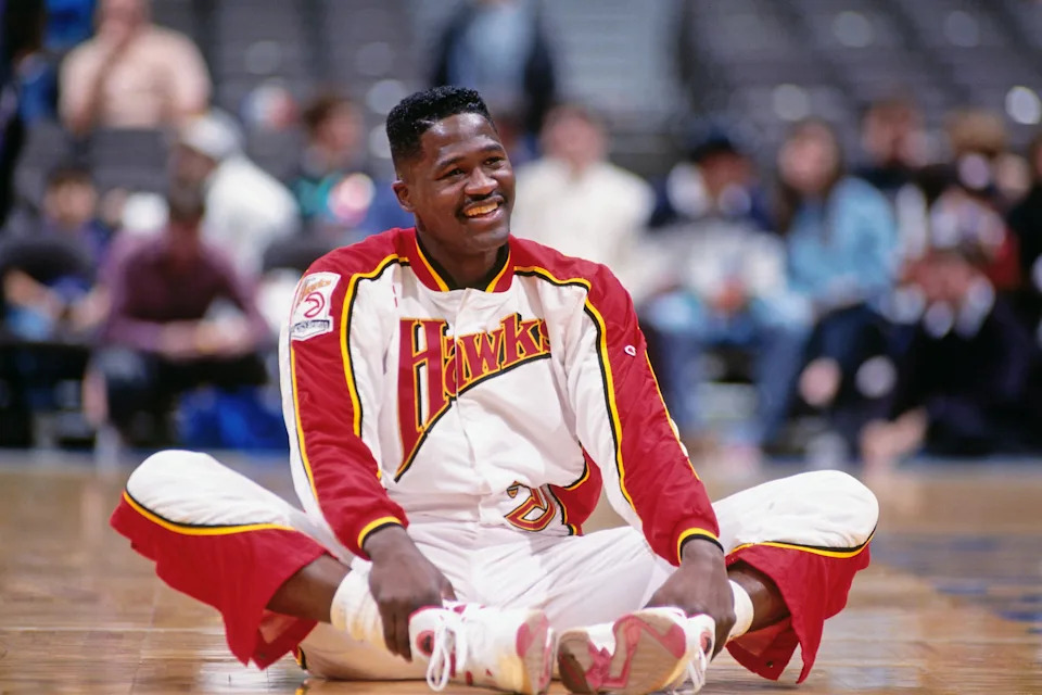 EAST RUTHERFORD, N.J. – 1993: Dominique Wilkins #21 of the Atlanta Hawks stretches against the New Jersey Nets during a game played circa 1993 at the Brendan Byrne Arena in East Rutherford, New Jersey. NOTE TO USER: User expressly acknowledges and agrees that, by downloading and or using this photograph, User is consenting to the terms and conditions of the Getty Images License Agreement. Mandatory Copyright Notice: Copyright 1993 NBAE (Photo by Nathaniel S. Butler/NBAE via Getty Images) | NBAE via Getty Images