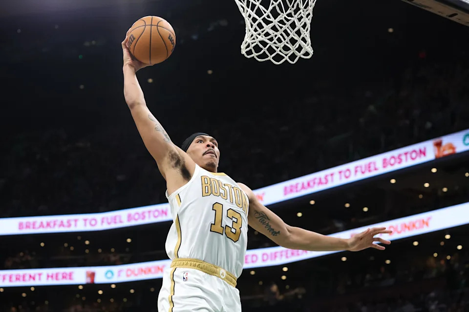 Apr 12, 2026; Boston, Massachusetts, USA; Boston Celtics forward Ron Harper Jr (13) dunks the ball during the second half against the Orlando Magic at TD Garden. Mandatory Credit: Paul Rutherford-Imagn Images