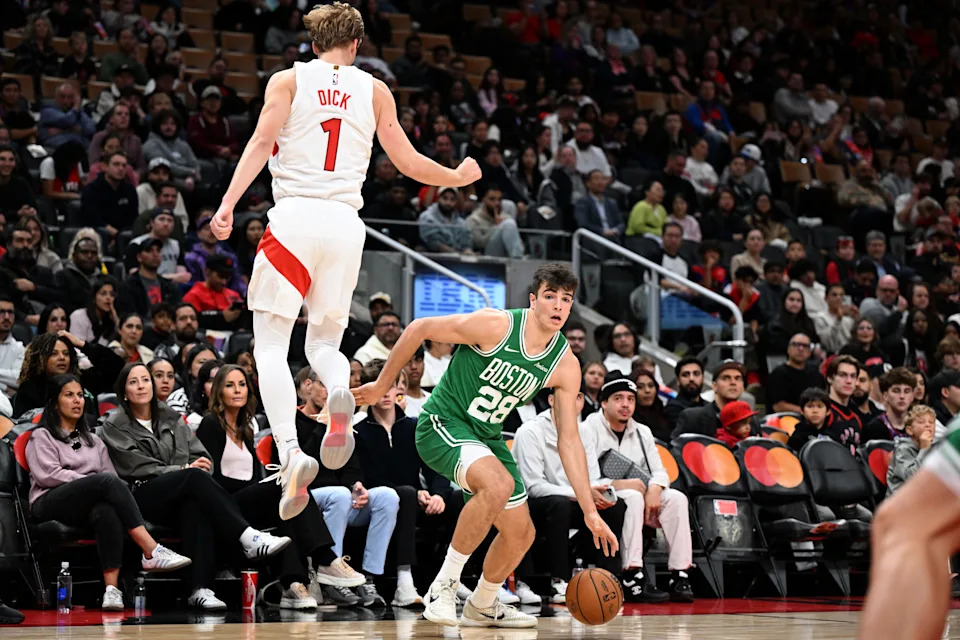 Oct 10, 2025; Toronto, Ontario, CAN; Boston Celtics forward Hugo Gonzalez (28) draws Toronto Raptors forward Gradey Dick (1) out of position in the first half at Scotiabank Arena. Mandatory Credit: Dan Hamilton-Imagn Images