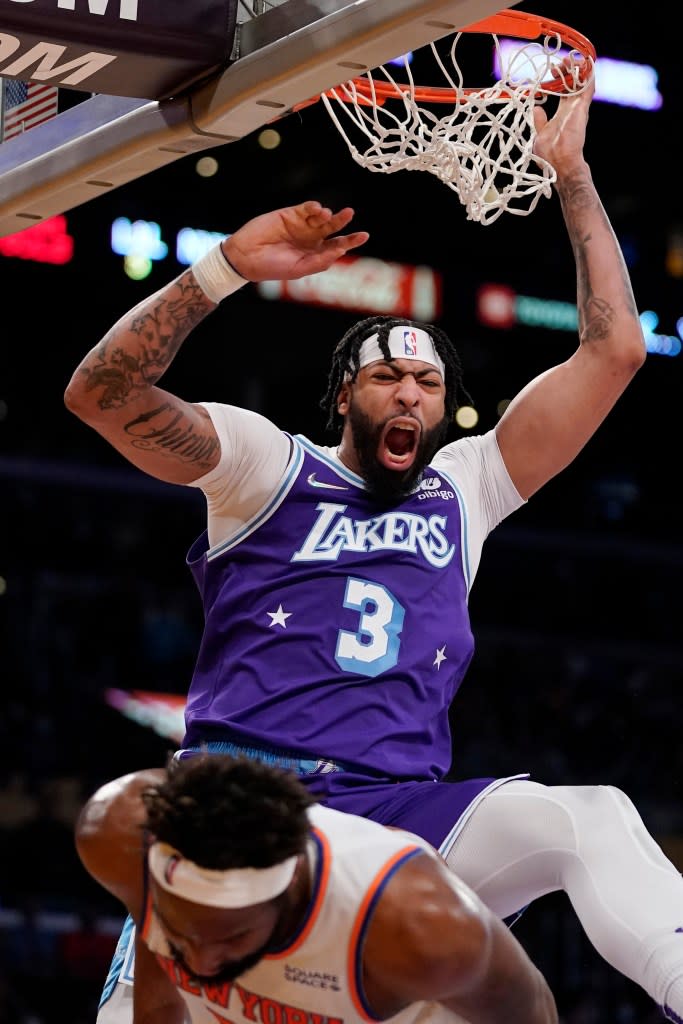 Anthony Davis celebrates as he dunks over New York Knicks center Mitchell Robinson. AP