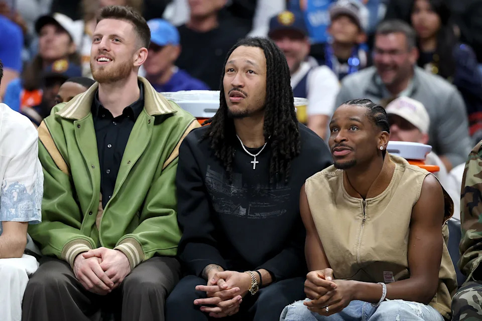 DENVER, COLORADO - APRIL 10: Isaiah Hartenstein #55, Jalen Williams #8, and Shai Gilgeous-Alexander #2 of the Oklahoma City Thunder watch the game against the Denver Nuggets during the first quarter at Ball Arena on April 10, 2026 in Denver, Colorado. NOTE TO USER: User expressly acknowledges and agrees that, by downloading and or using this photograph, User is consenting to the terms and conditions of the Getty Images License Agreement. (Photo by Matthew Stockman/Getty Images)