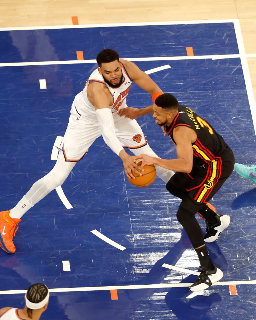 Karl-Anthony Towns defends against CJ McCollum during the third quarter of the Knicks’ Game 1 win over the Hawks. Jason Szenes / New York Post