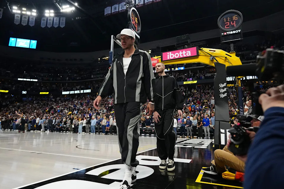 Apr 10, 2026; Denver, Colorado, USA; Denver Nuggets forward Aaron Gordon (32) and guard Christian Braun (0) arrive during the first quarter against the Oklahoma City Thunder at Ball Arena. Mandatory Credit: Ron Chenoy-Imagn Images