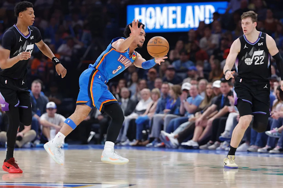 Apr 5, 2026; Oklahoma City, Oklahoma, USA; Oklahoma City Thunder guard Jared McCain (3) passes beside Utah Jazz forward Kyle Filipowski (22) during the second quarter at Paycom Center. Mandatory Credit: Alonzo Adams-Imagn Images