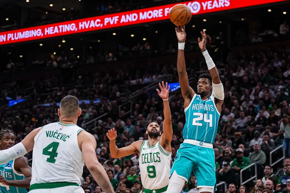 Apr 7, 2026; Boston, Massachusetts, USA; Charlotte Hornets forward Brandon Miller (24) shoots the ball against Boston Celtics guard Derrick White (9) in the second half at TD Garden. Mandatory Credit: David Butler II-Imagn Images