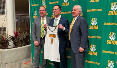 Siena head coach Nevada Smith with Siena University president Chuck Seifert and Siena athletic director John D'Argenio at the MVP Arena.