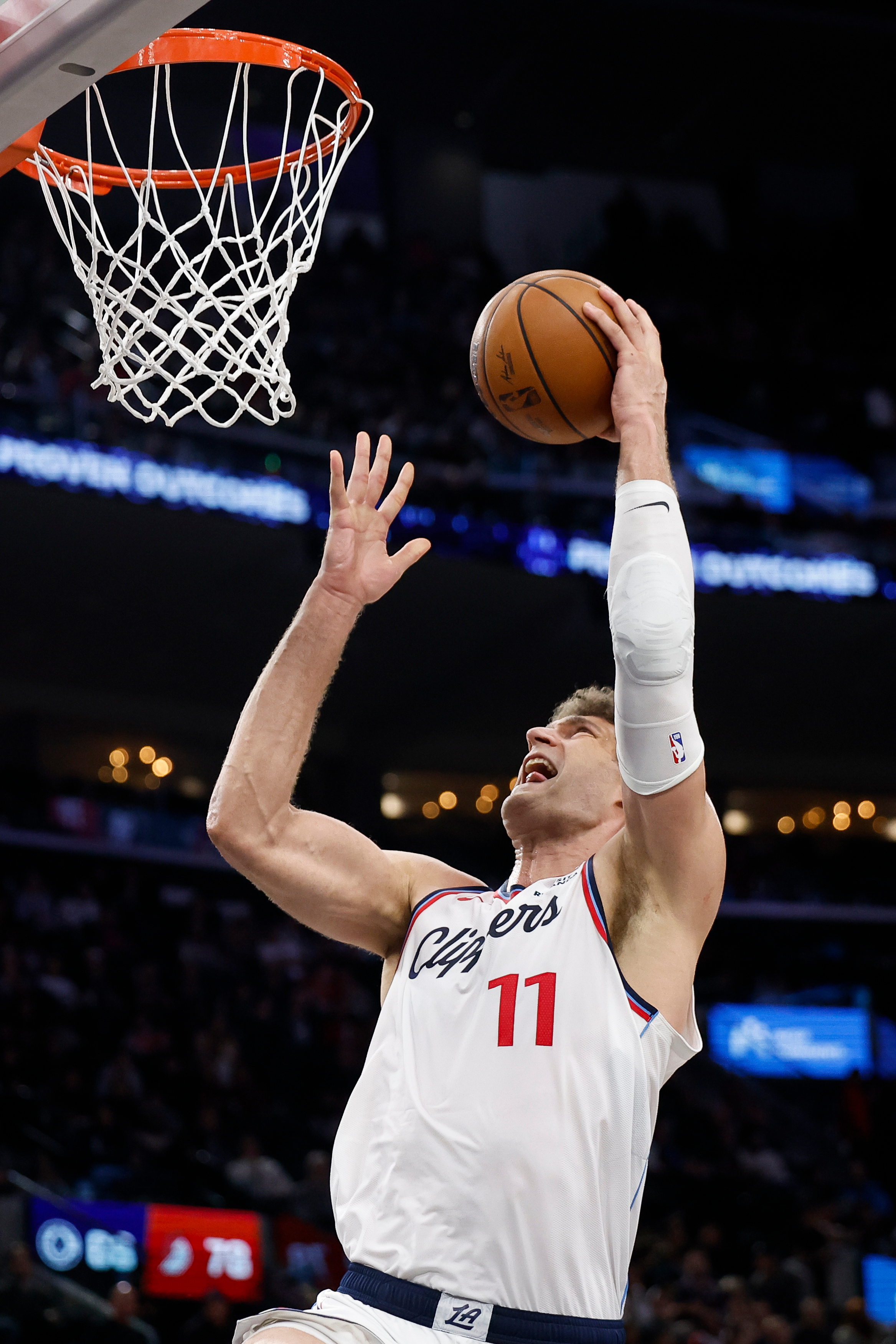 Clippers center Brook Lopez drives to the basket during the...