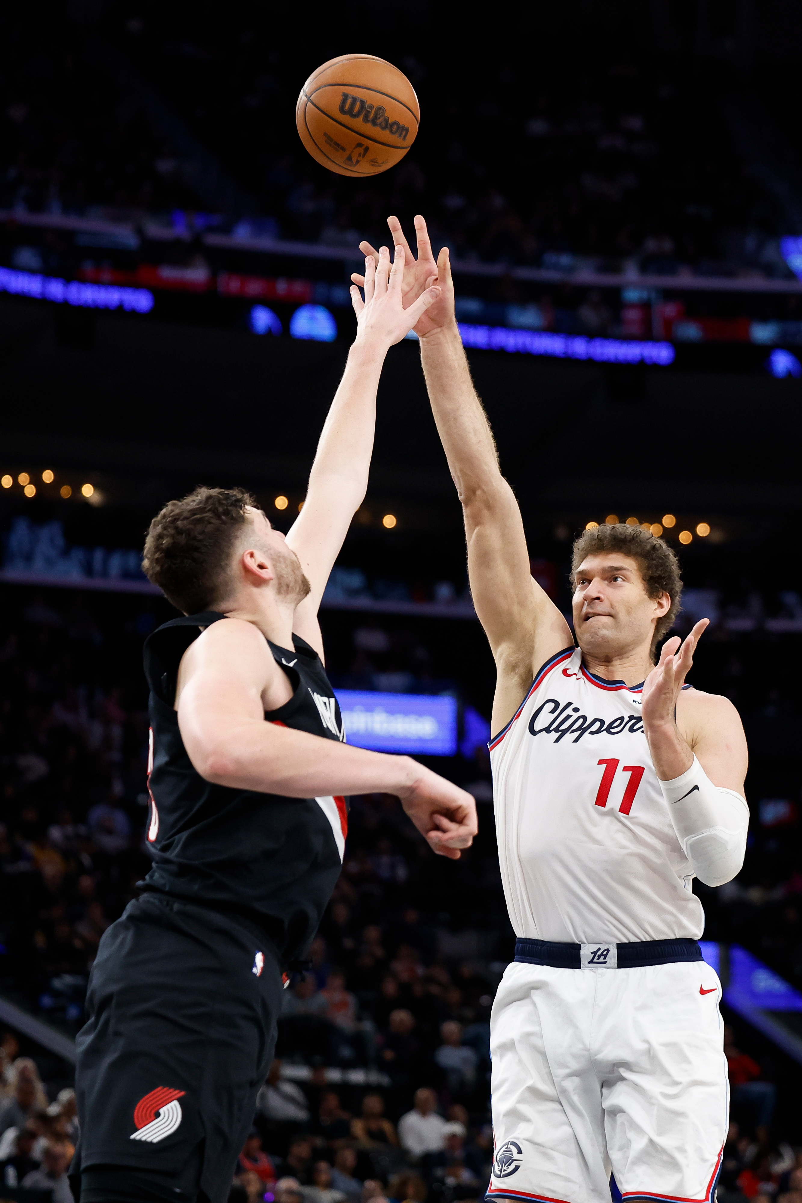 Clippers center Brook Lopez, right, takes a shot as Portland...