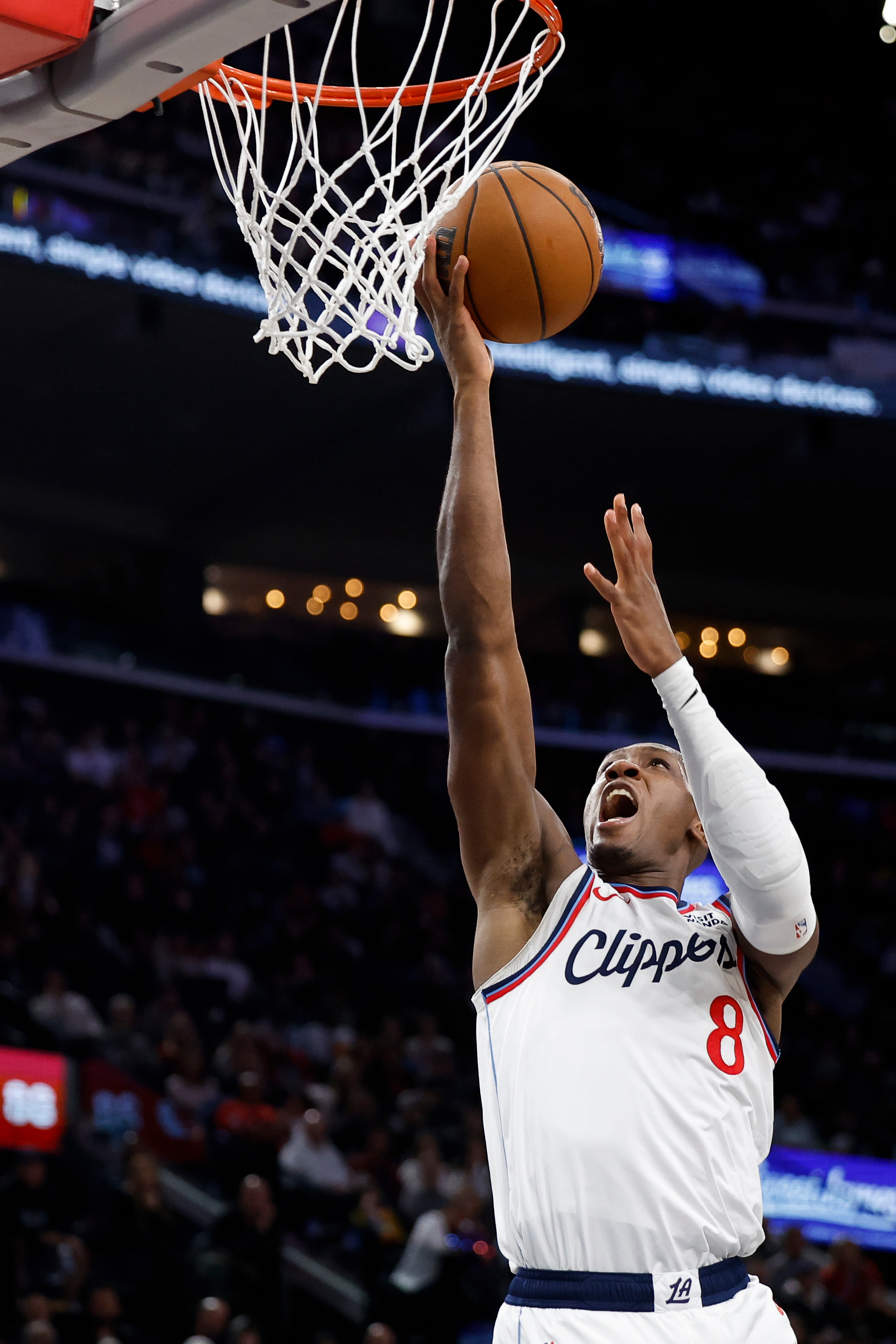 Clippers guard Kris Dunn drives to the basket with the...