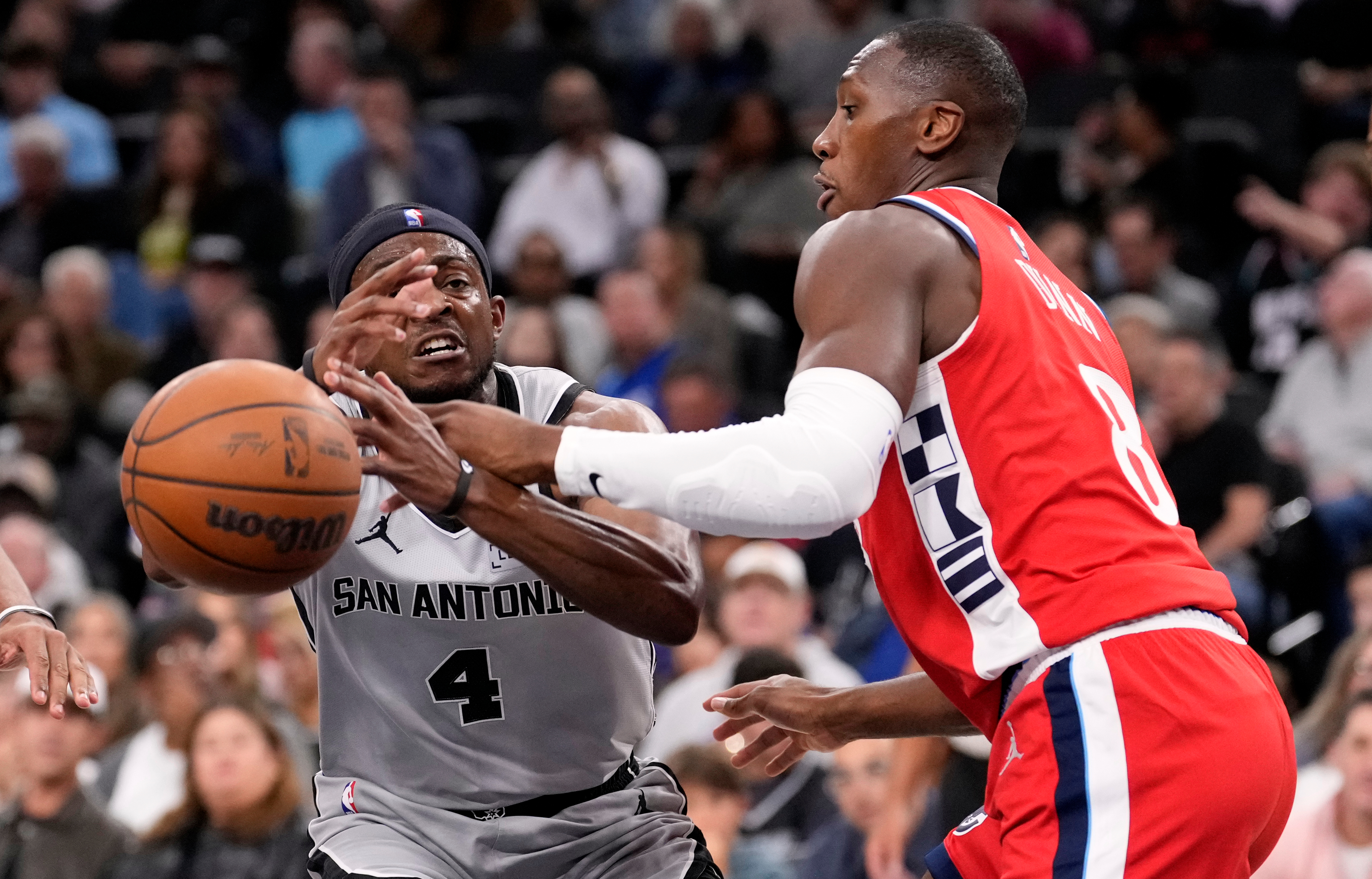 Clippers guard Kris Dunn, right, knocks the ball from the...