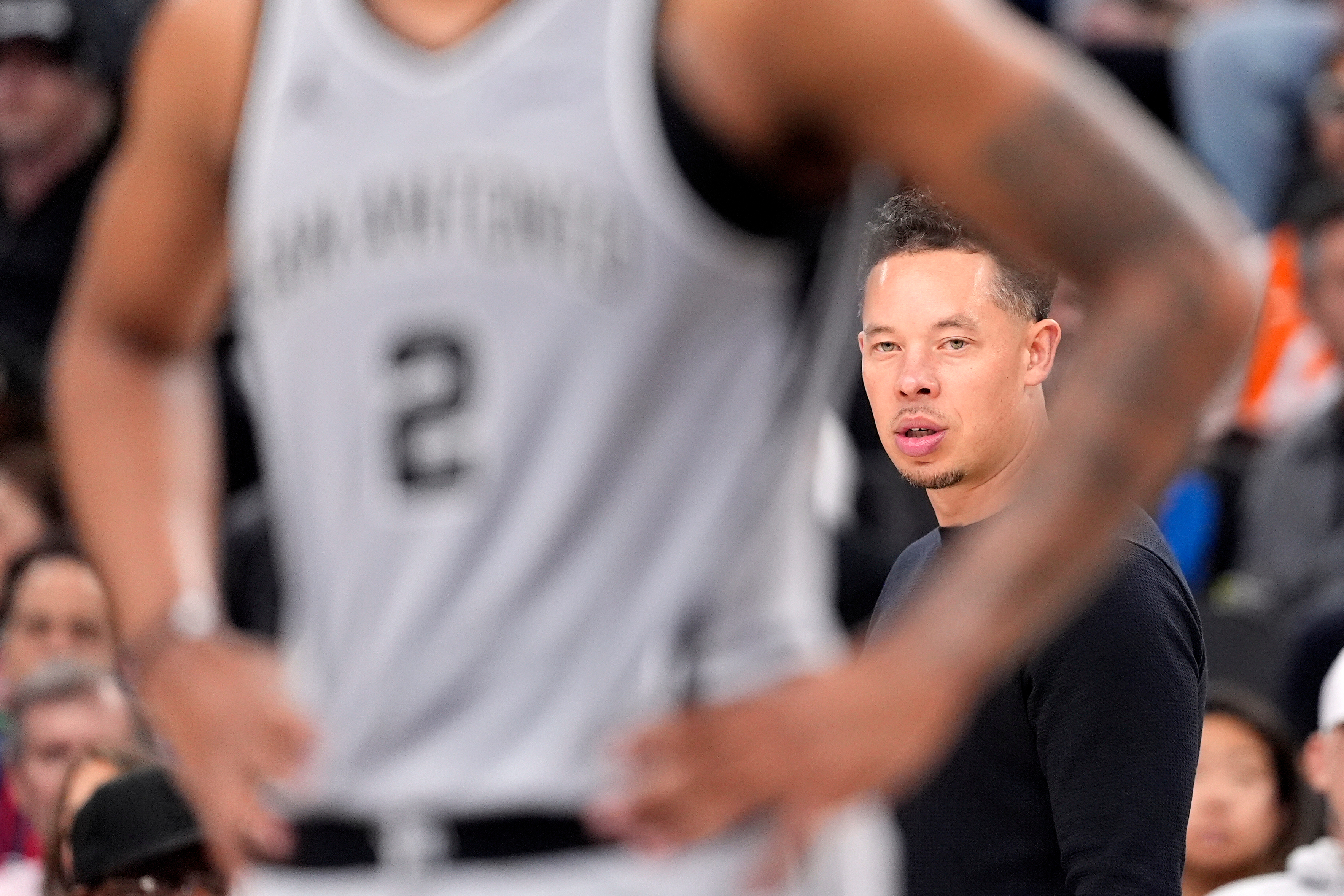San Antonio Spurs head coach Mitch Johnson, right, is seen...