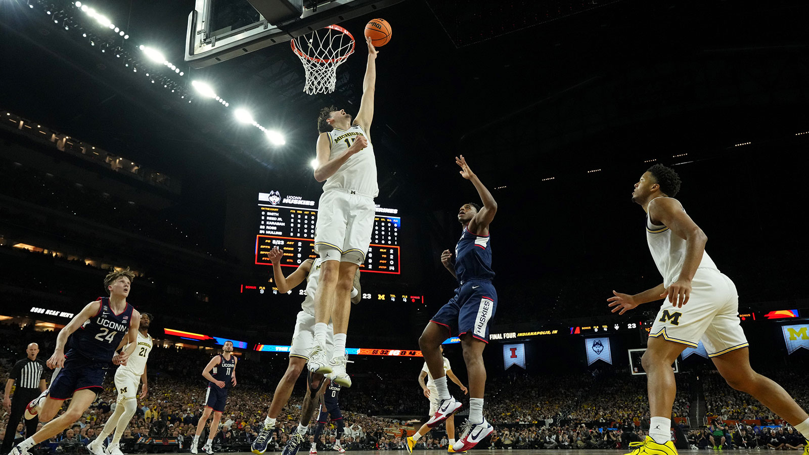 Michigan Wolverines center Aday Mara (15) blocks the shot of UConn Huskies forward Tarris Reed Jr. (5) during the first half in the national championship of the Final Four of the men's 2026 NCAA Tournament between the and the Michigan Wolverines at Lucas Oil Stadium. 