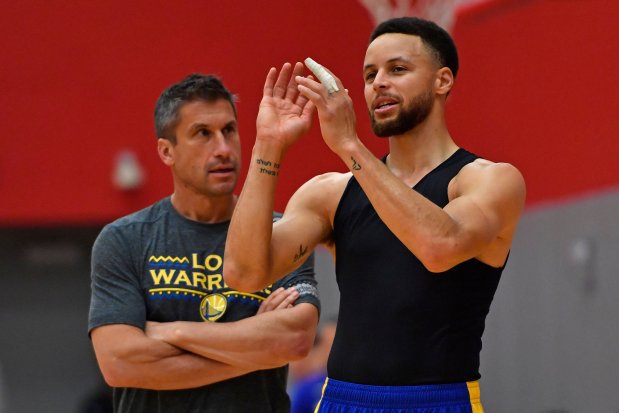 Golden State Warriors' Stephen Curry (30) speaks to Golden State Warriors Director of Sports Medicine and Performance Dr. Rick Celebrini about his finger during a practice session at the University of Houston in Houston, Texas on Friday, May 3, 2019. The Warriors will face the Houston Rockets tomorrow for Game 3 of their NBA second round playoff series. (Jose Carlos Fajardo/Bay Area News Group)