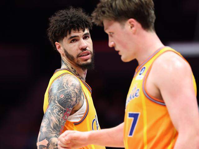 Charlotte Hornets guard LaMelo Ball, left, speaks to forward Kon Knueppel, right, during action against the Memphis Grizzlies at Spectrum Center in Charlotte, NC on Saturday, March 21, 2026. The Hornets defeated the Grizzlies 124-101.