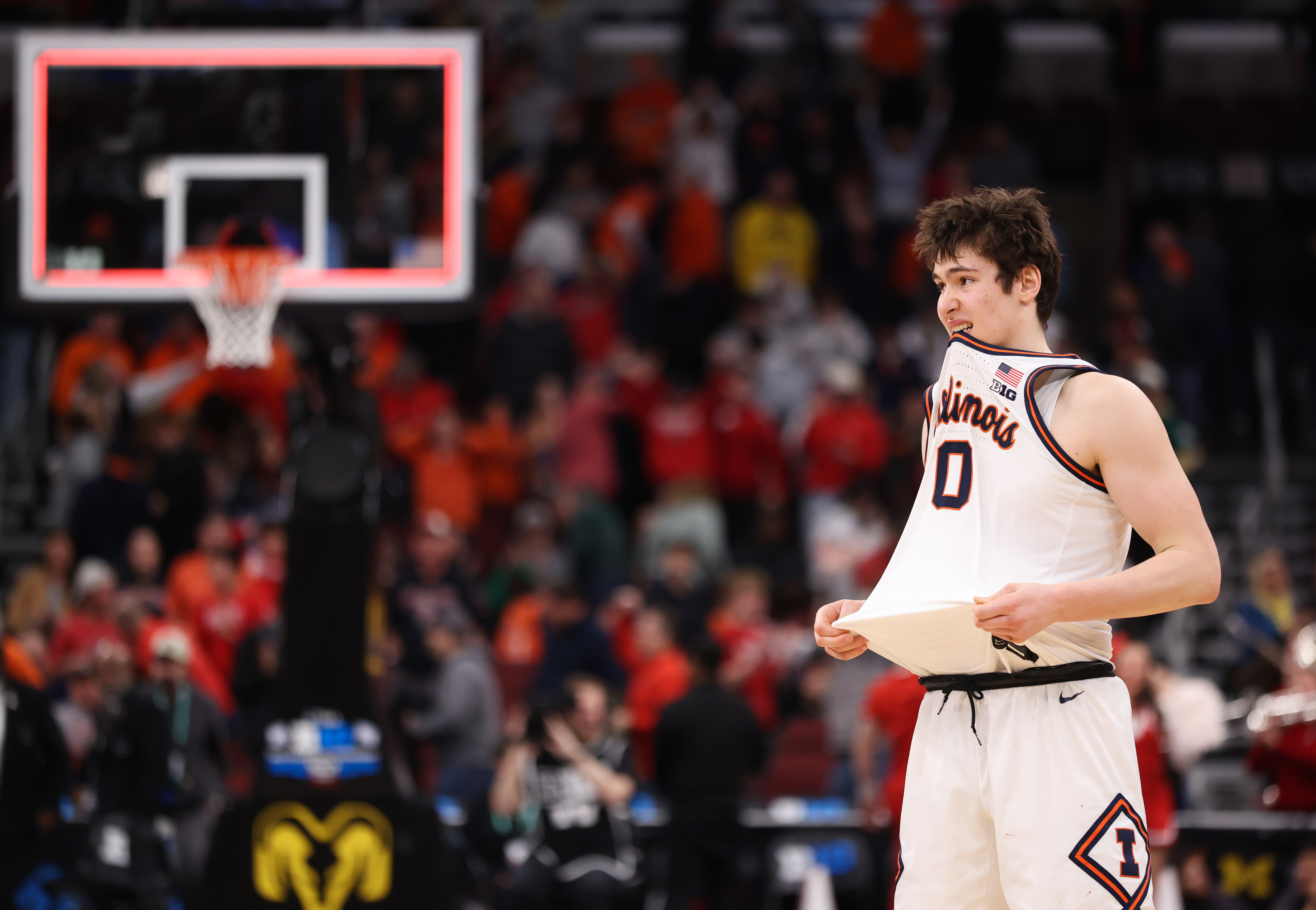 Illinois forward David MirkoviÄ bites his uniform as the buzzer...