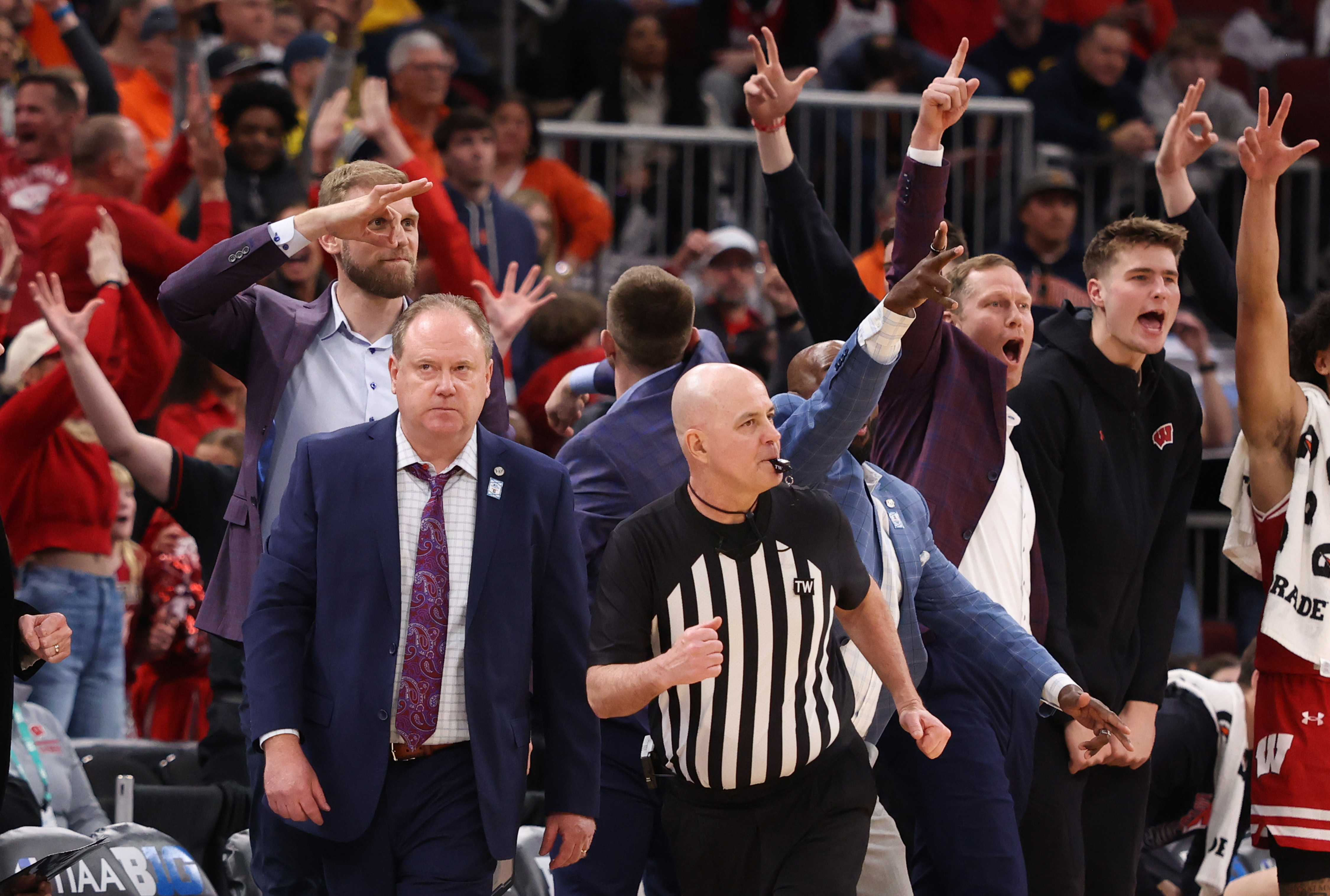 Wisconsin coaches celebrate a 3-pointer in overtime against Illinois during...