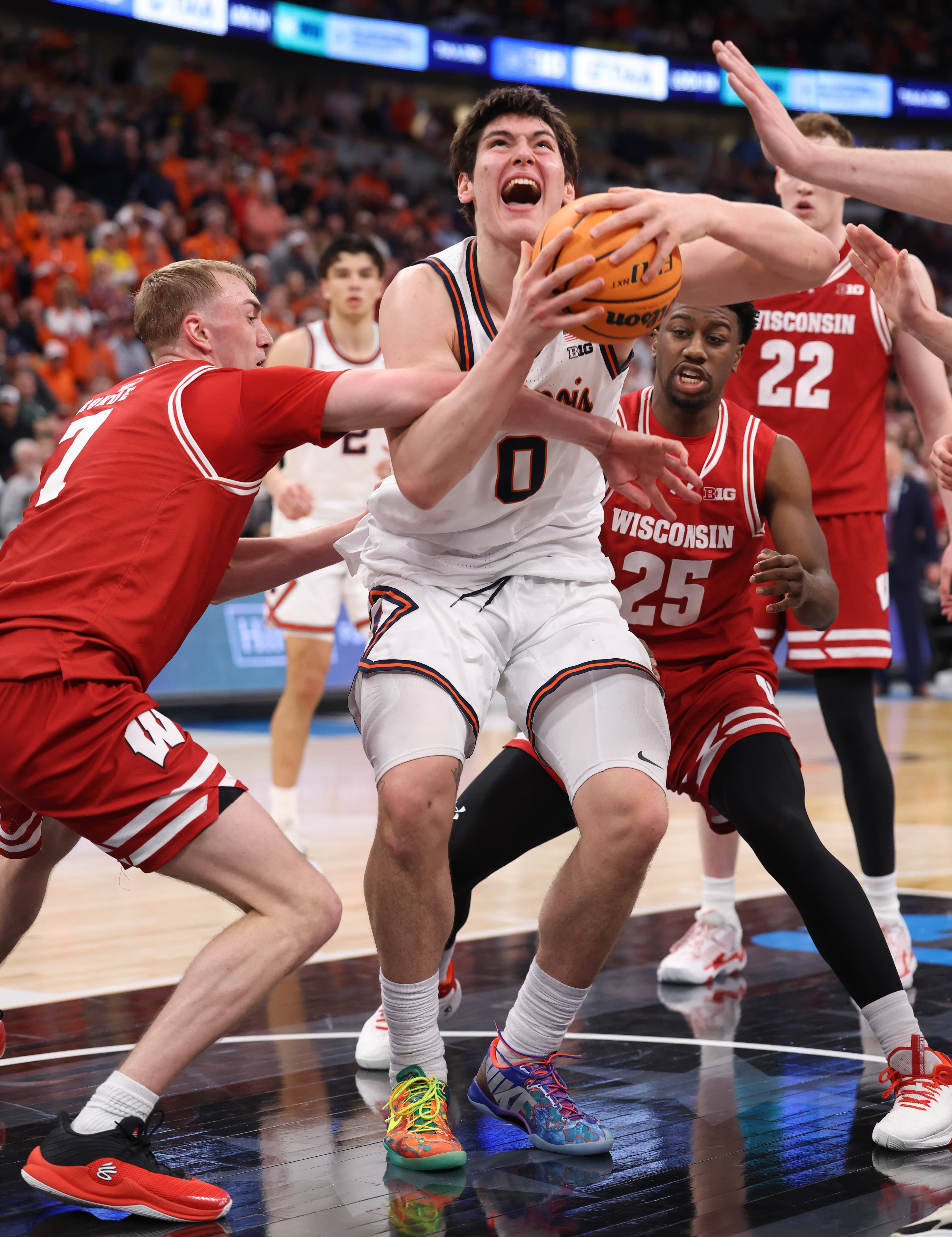Illinois forward David MirkoviÄ (0) is fouled by Wisconsin guard...