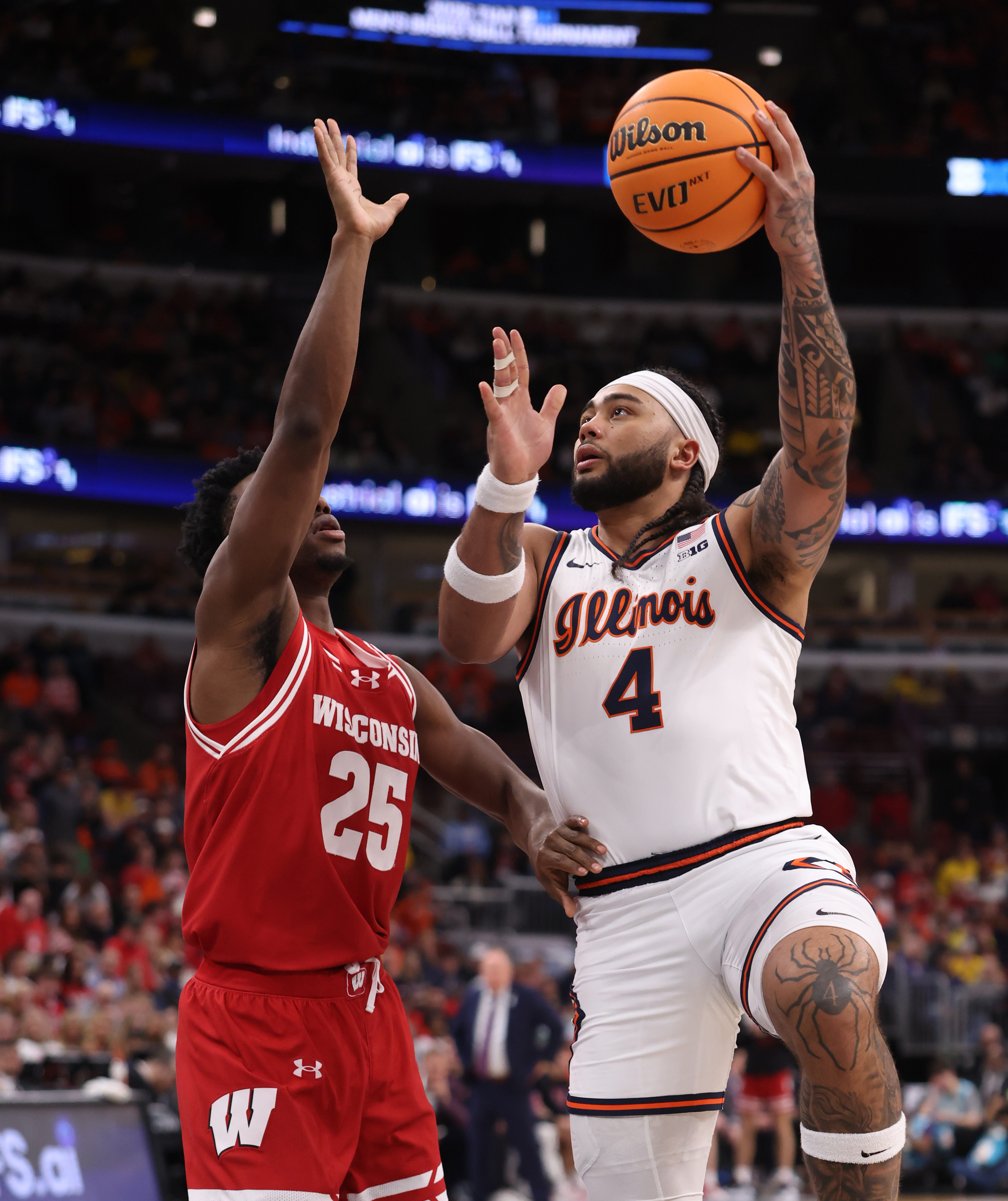 Illinois guard Kylan Boswell (4) aims for the basket as...
