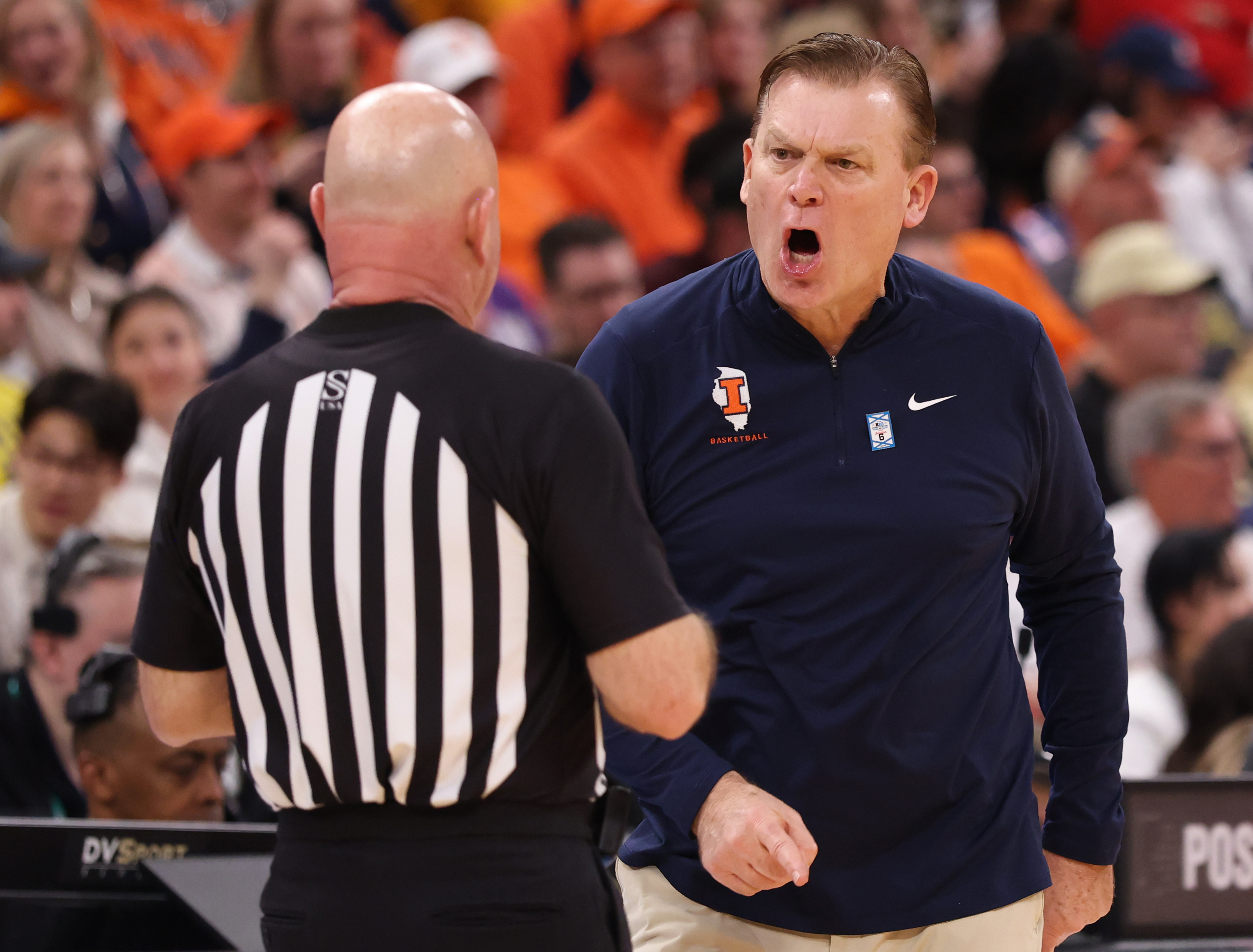 Illinois coach Brad Underwood argues with an official in the...