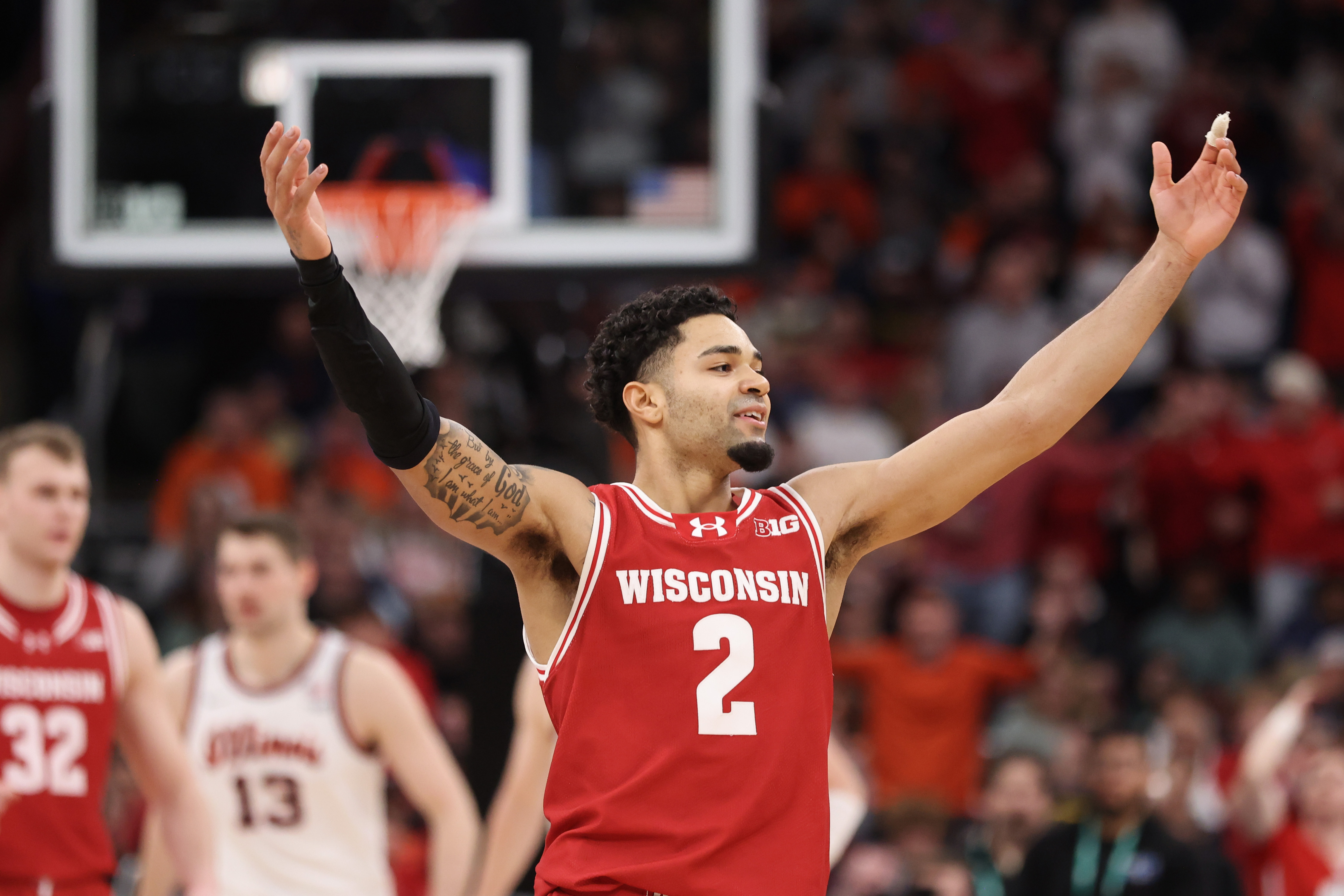 Wisconsin guard Nick Boyd encourages fans to make noise in...
